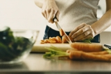 Picture of person chopping vegetables.