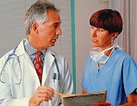 Picture of a physician and nurse reviewing a patient