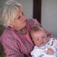 Picture of a grandmother holding her granddaughter