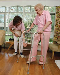 Picture of an elderly woman using a walker during a physical therapy session