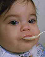 Picture of a baby being fed with a spoon