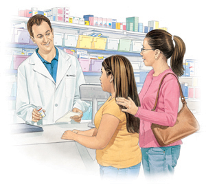 Pharmacist talking to woman and girl at pharmacy counter.