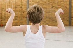 Boy flexing biceps