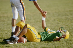 Football player lying on the field