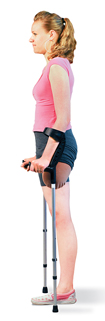 Woman with amputated leg, standing between crutches.