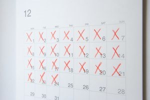 Image of a calender with several days filled with a red 