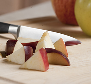 Knife and apple pieces.