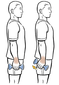 Man standing doing ulnar deviation exercise with hand weight.
