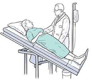 Healthcare provider doing tilt table test with female patient.