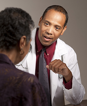 Healthcare provider talking to woman.