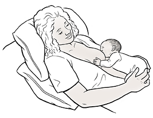 Woman breastfeeding baby in laid-back position.