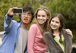 Teenagers taking a photo.