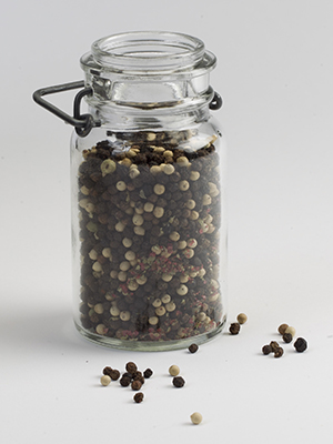 Glass jar of peppercorns.
