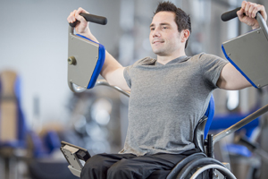 Man in wheelchair at lifting weights