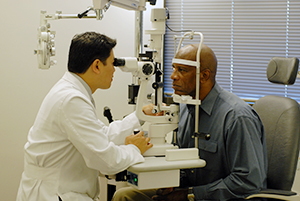 Patient being examined by optometrist.
