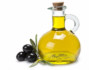 Olive oil is a good source of unsaturated fat. Bottle of olive oil.