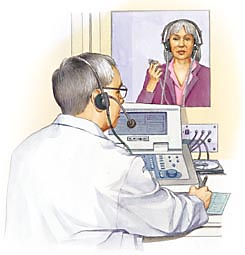 Hearing specialist testing woman's hearing