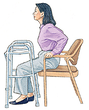 Woman lowering herself onto chair before sliding back.