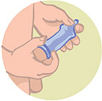 Male putting condom on penis