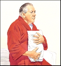 Man holding pillow against his incision