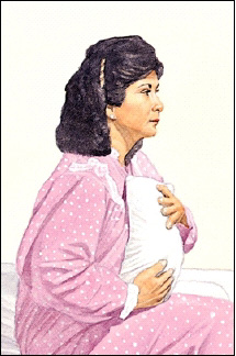 Woman holding pillow against her incision