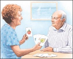 Woman using flash cards to help a man