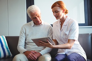 A nurse talks with a caregiver.