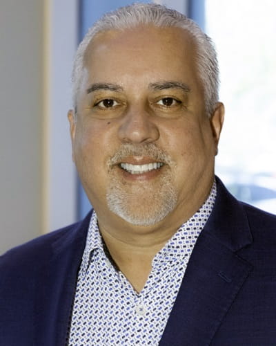 a headshot photo of Rick Colon