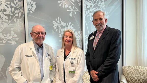 Three doctors standing next to each other