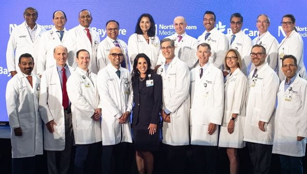 A picture of BayCare President and CEO Stephanie Conners standing next to Northwestern Medicine Physicians