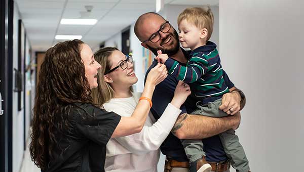 photo of wyatt quevedo and dr erin cockrell and family in hospital