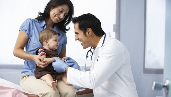Doctor Examining Baby Girl
