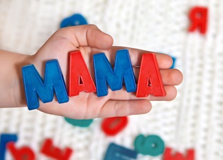 The child is of colored letters on the palm of the word mother