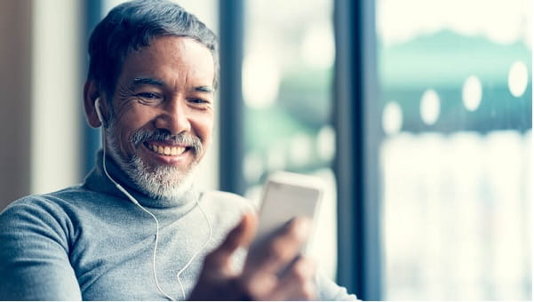 mature man on a mobile device