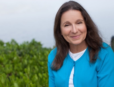 dark-haired woman in a blue sweater