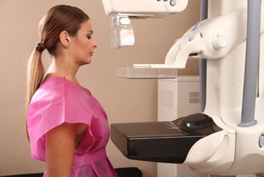 A woman is preparing for her mammogram.