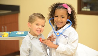 young boy and girl dressed as doctors