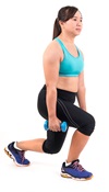 A woman is exercising with hand weights.