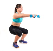 A woman is exercising with hand weights.