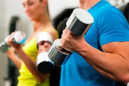 A man is lifting weights in the gym.