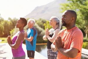 group of people practicing yoga