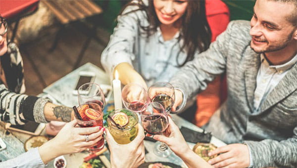 group of people eating and toasting