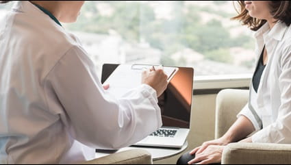 A patient being consulted by their provider