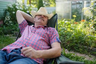 mature male taking a nap outside 