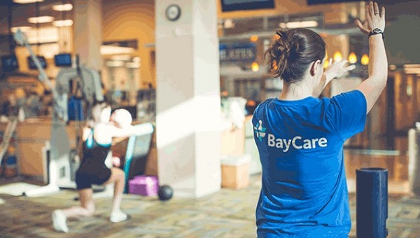 A team member is working out in a BayCare Fitness Center.