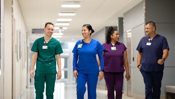 Team members walking in hallway