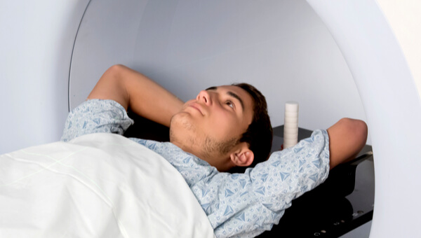 Young male patient laying on imaging table