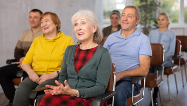 Mature audience attending an event.