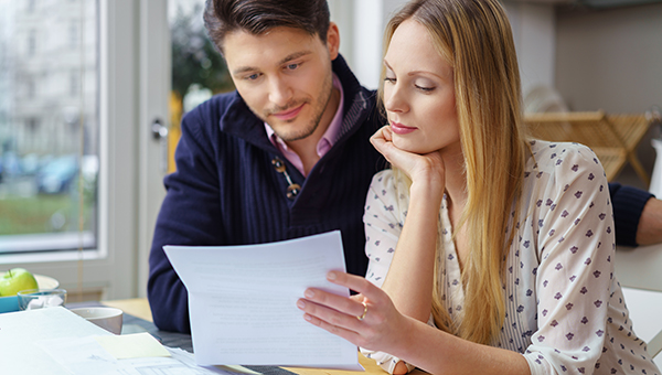 Young couple reviewing paperwork