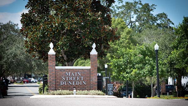 A large outdoor brick sign that reads "Main Street Dunedin"